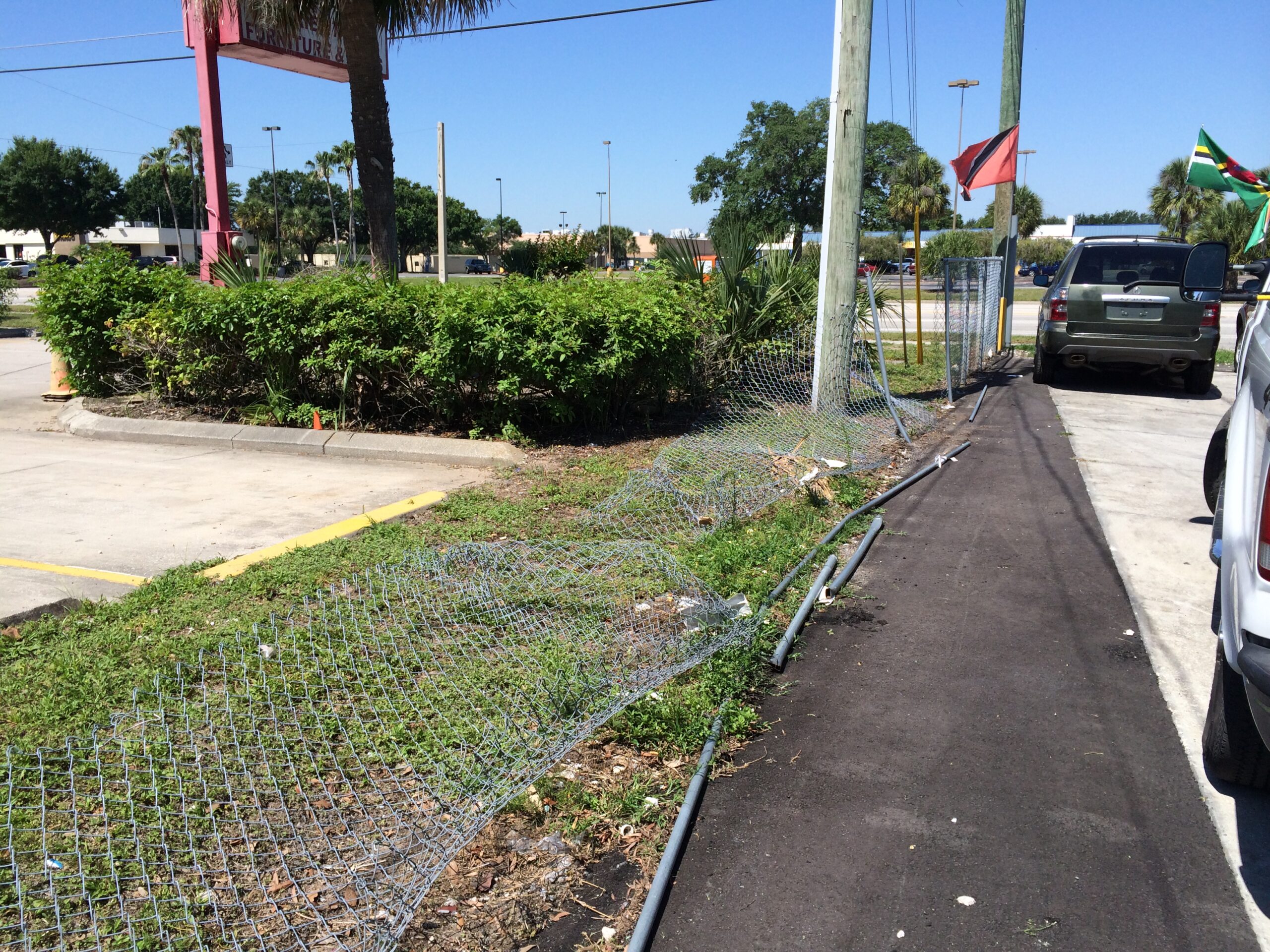 Fence repair in Titusville FL by Alpha Omega Fence Chain link fence repair in Titusville Florida Wood fence repair in Titusville FL 