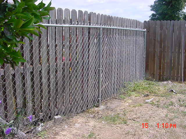 Fence repair in Titusville FL by Alpha Omega Fence Chain link fence repair in Titusville Florida Wood fence repair in Titusville FL 