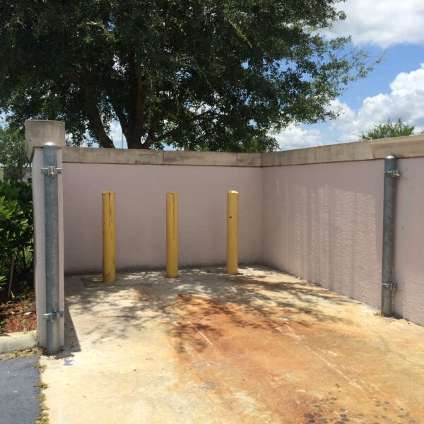 Commercial chain link fence repair completed in Orlando, FL with new posts and restored fence alignment.